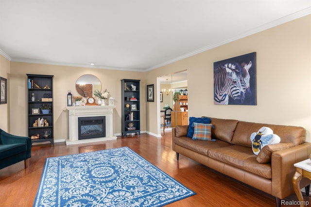 2960 Timberwyck Trail Dr, Troy, MI 48098 - living area with wood finished floors, a chandelier, crown molding, a glass covered fireplace, and built in shelves