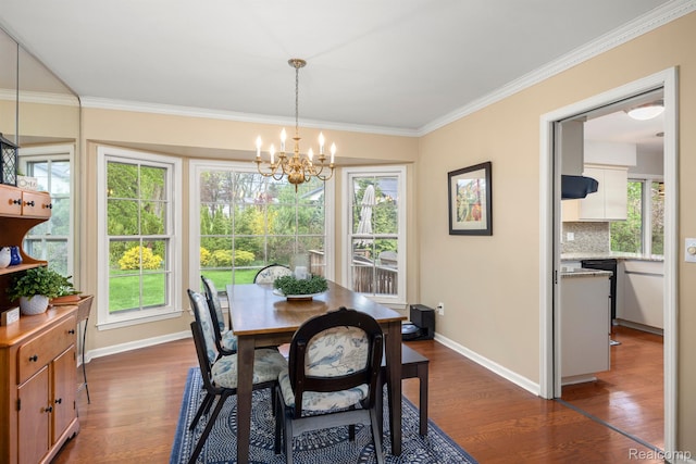 2960 Timberwyck Trail Dr, Troy, MI 48098 - dining room featuring dark wood-type flooring, a chandelier, baseboards, and crown molding