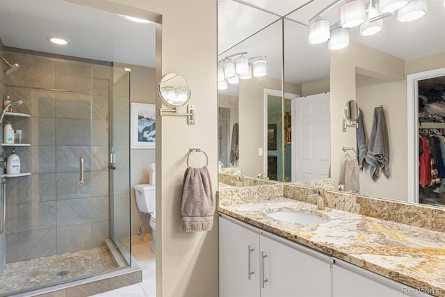 2960 Timberwyck Trail Dr, Troy, MI 48098 - full bath featuring vanity, a shower stall, toilet, tile patterned flooring, and a walk in closet