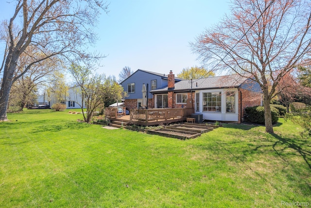 2960 Timberwyck Trail Dr, Troy, MI 48098 - rear view of house featuring brick siding, a deck, a chimney, and a yard