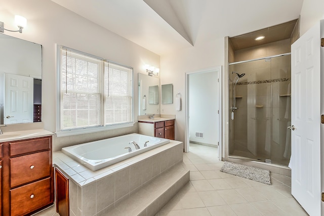 2129 Autumn Hill Dr, Ann Arbor, MI 48103 - bathroom featuring a shower stall, a garden tub, tile patterned flooring, and two vanities