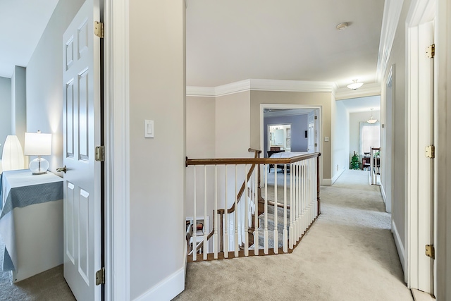 2129 Autumn Hill Dr, Ann Arbor, MI 48103 - hallway with carpet, an upstairs landing, ornamental molding, and baseboards