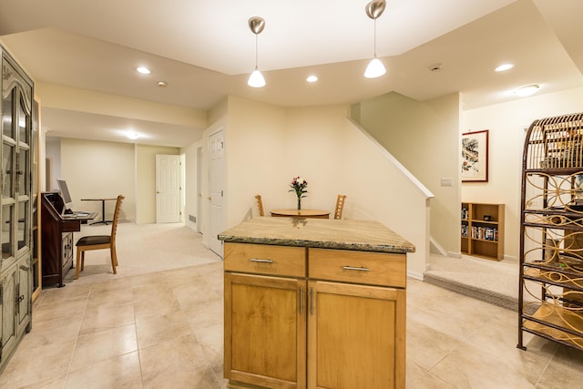 2129 Autumn Hill Dr, Ann Arbor, MI 48103 - kitchen featuring light colored carpet, hanging light fixtures, recessed lighting, light tile patterned floors, and stone countertops