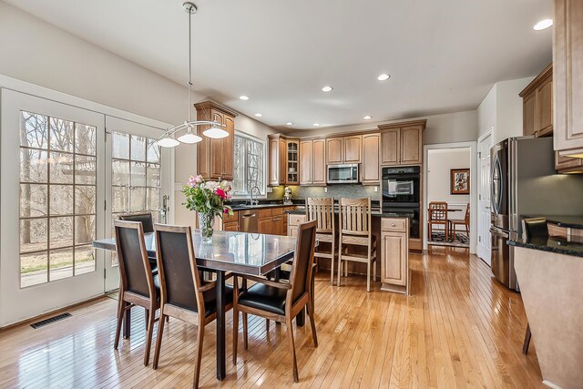 2129 Autumn Hill Dr, Ann Arbor, MI 48103 - dining room featuring healthy amount of natural light, light wood-type flooring, and recessed lighting