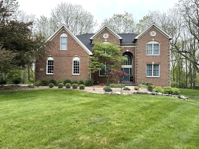 2129 Autumn Hill Dr, Ann Arbor, MI 48103 - view of front facade featuring brick siding and a front yard