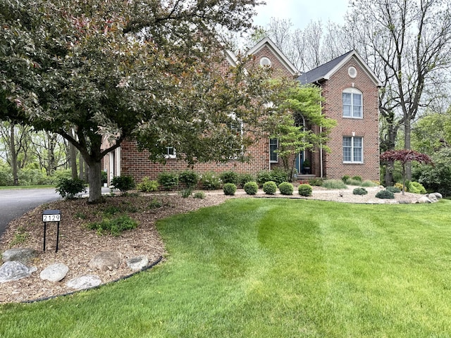 2129 Autumn Hill Dr, Ann Arbor, MI 48103 - view of front of property featuring brick siding and a front yard