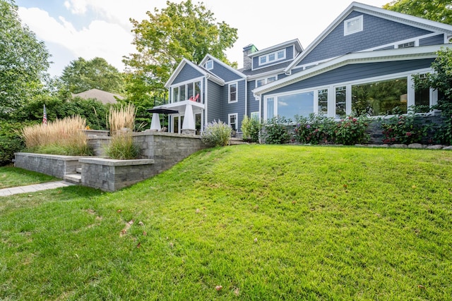 7881 Lakewood Dr, Coloma, MI 49038 - back of property featuring a yard