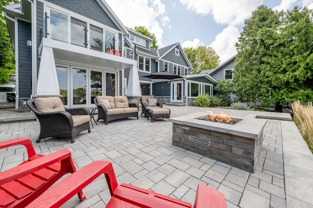 7881 Lakewood Dr, Coloma, MI 49038 - view of patio with french doors and an outdoor living space with a fire pit