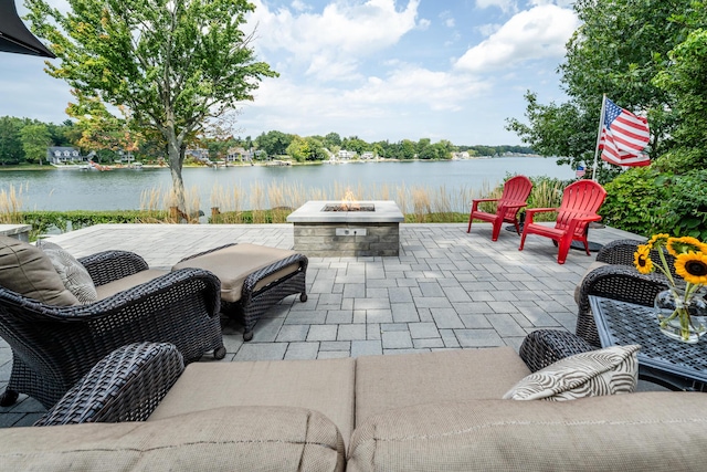 7881 Lakewood Dr, Coloma, MI 49038 - view of patio / terrace with a fire pit and a water view