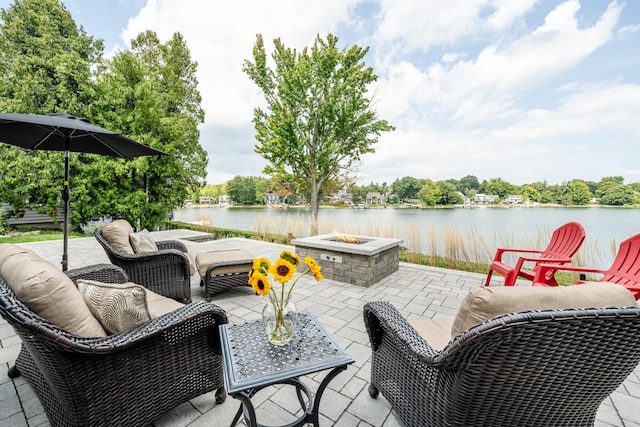 7881 Lakewood Dr, Coloma, MI 49038 - view of patio featuring a fire pit and a water view