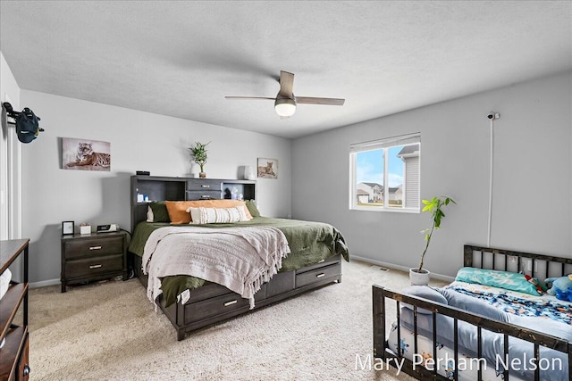 carpeted bedroom with baseboards and a ceiling fan