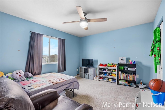 carpeted bedroom with a ceiling fan