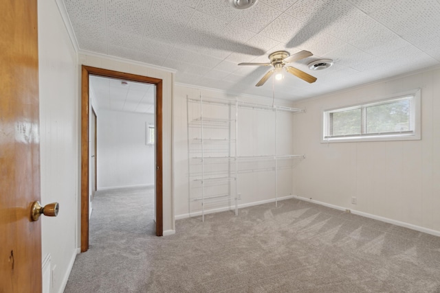 5277 Kay Dr, Jackson, MI 49203 - unfurnished bedroom featuring carpet flooring, ornamental molding, ceiling fan, and baseboards