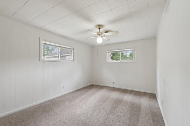 5277 Kay Dr, Jackson, MI 49203 - carpeted empty room featuring plenty of natural light, a ceiling fan, and baseboards