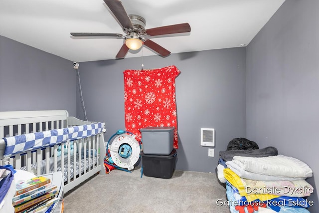 11660 Wren Dr, Lakeview, MI 48850 - bedroom with carpet, heating unit, ceiling fan, and a crib