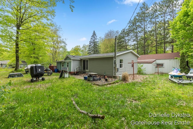 11660 Wren Dr, Lakeview, MI 48850 - back of property with a lawn