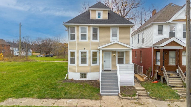 1426 Canton St, Detroit, MI 48207 - american foursquare style home with a front yard and a shingled roof
