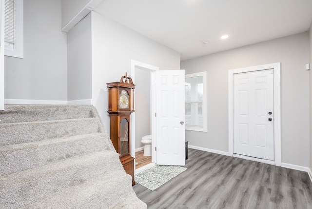 1426 Canton St, Detroit, MI 48207 - stairs with wood finished floors, baseboards, and recessed lighting