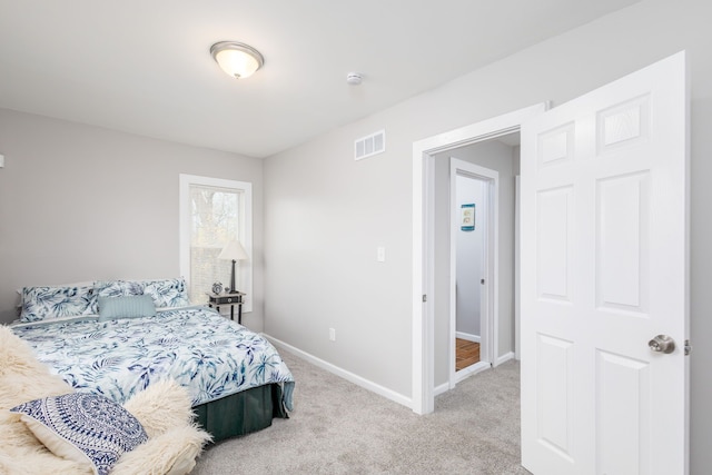 1426 Canton St, Detroit, MI 48207 - bedroom featuring baseboards and light colored carpet