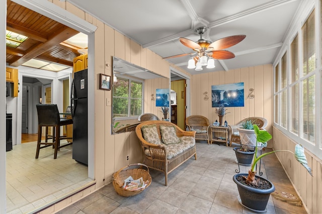 449 Spruce St, Wyandotte, MI 48192 - sunroom / solarium featuring a ceiling fan, beamed ceiling, tile patterned floors, an outdoor hangout area, and coffered ceiling