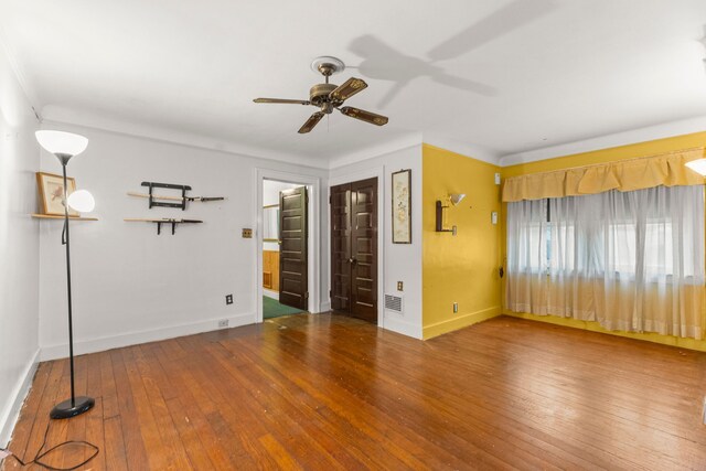 449 Spruce St, Wyandotte, MI 48192 - empty room featuring wood-type flooring, a ceiling fan, and baseboards