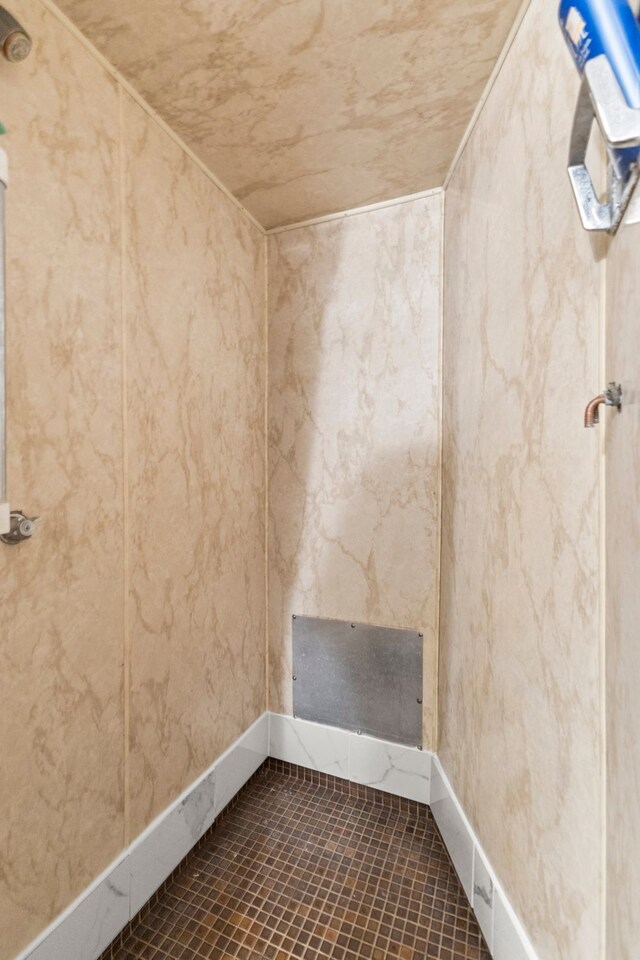 449 Spruce St, Wyandotte, MI 48192 - spare room with baseboards and dark tile patterned floors