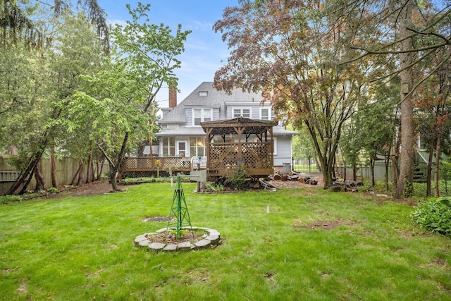 449 Spruce St, Wyandotte, MI 48192 - back of property with a wooden deck, a pergola, and a chimney