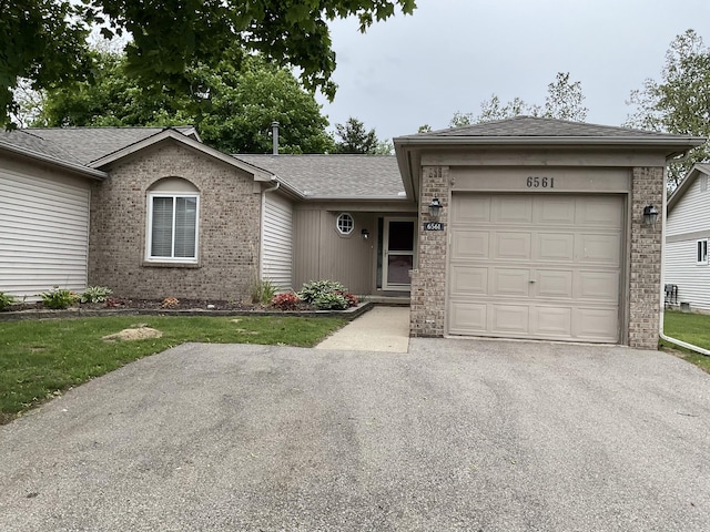 6561 Deerhurst Dr, Westland, MI 48185 - ranch-style home with brick siding, an attached garage, asphalt driveway, and a shingled roof