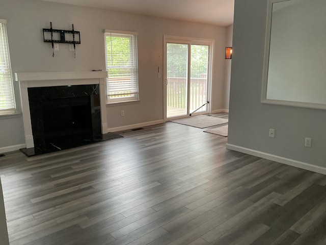 6561 Deerhurst Dr, Westland, MI 48185 - unfurnished living room featuring wood finished floors, a fireplace, and baseboards