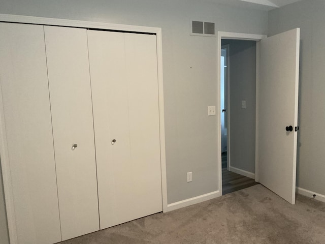 6561 Deerhurst Dr, Westland, MI 48185 - unfurnished bedroom featuring light carpet, baseboards, and a closet