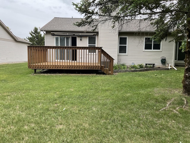 6561 Deerhurst Dr, Westland, MI 48185 - rear view of house featuring a wooden deck, a shingled roof, and a lawn