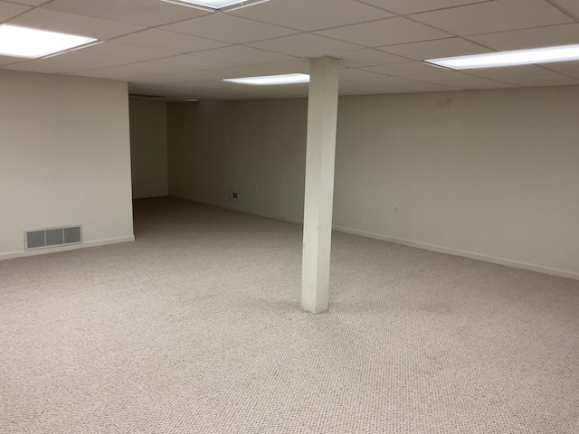 6561 Deerhurst Dr, Westland, MI 48185 - finished below grade area with a paneled ceiling, carpet flooring, and baseboards