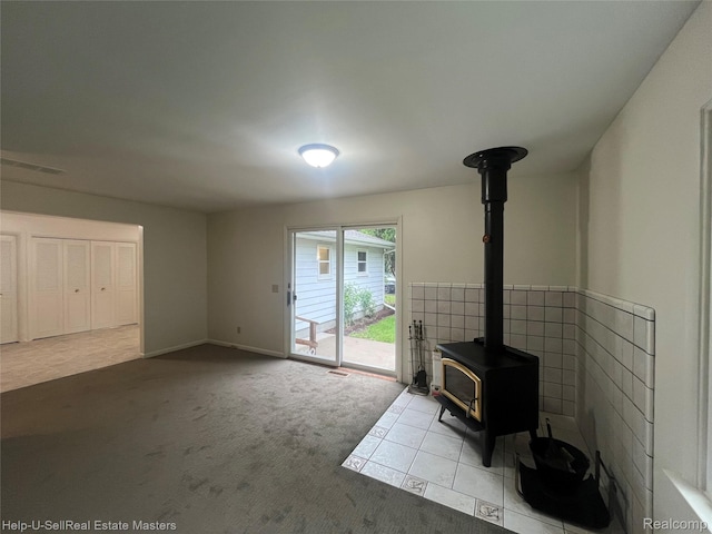 1420 Jones, Port Huron, MI 48060 - unfurnished living room with a wood stove and carpet flooring