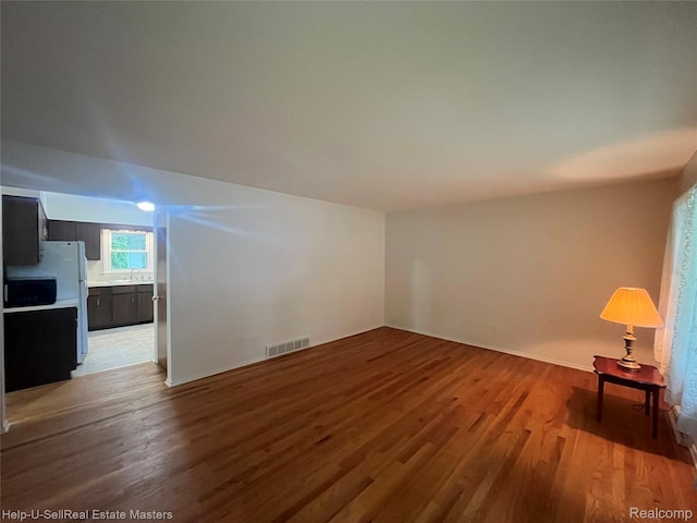 1420 Jones, Port Huron, MI 48060 - unfurnished living room with light wood-style flooring