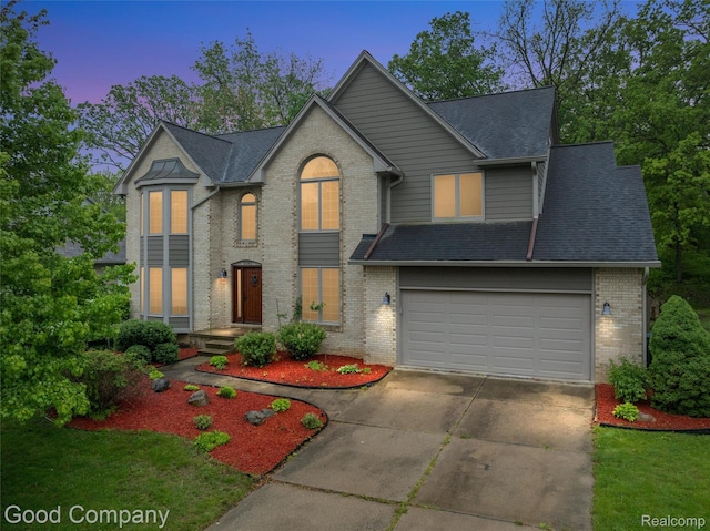 5893 Christina Dr, West Bloomfield, MI 48324 - view of front facade with concrete driveway, brick siding, and a shingled roof