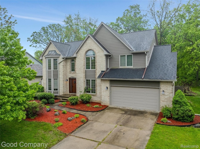 5893 Christina Dr, West Bloomfield, MI 48324 - view of front of property with brick siding, driveway, a shingled roof, and a garage