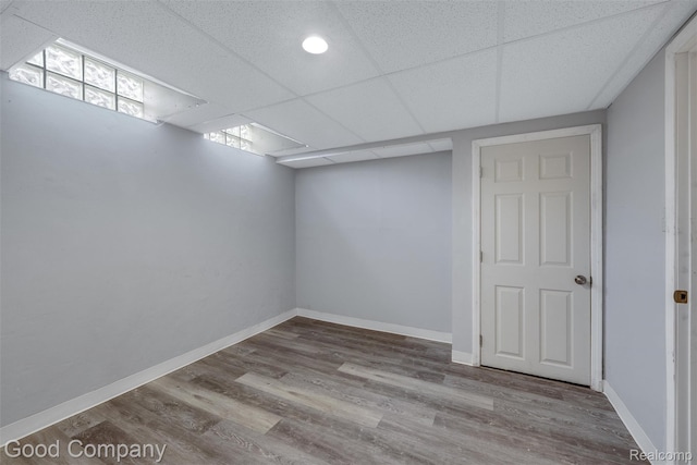 5893 Christina Dr, West Bloomfield, MI 48324 - below grade area featuring wood finished floors, baseboards, and a drop ceiling