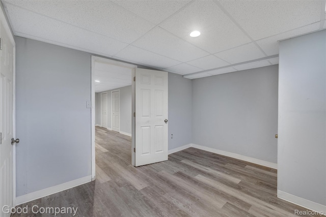 5893 Christina Dr, West Bloomfield, MI 48324 - unfurnished room featuring baseboards, wood finished floors, and a paneled ceiling