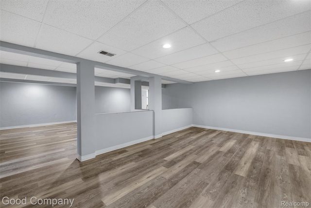 5893 Christina Dr, West Bloomfield, MI 48324 - finished basement with wood finished floors, baseboards, and a drop ceiling
