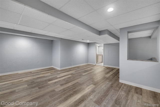 5893 Christina Dr, West Bloomfield, MI 48324 - finished below grade area featuring wood finished floors, a drop ceiling, baseboards, and recessed lighting