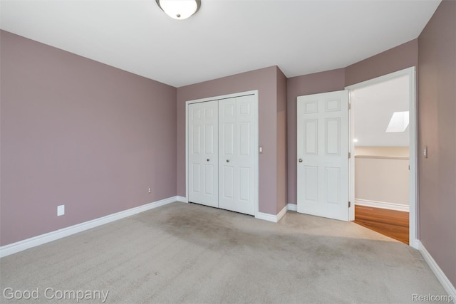 5893 Christina Dr, West Bloomfield, MI 48324 - unfurnished bedroom with carpet floors, baseboards, and a closet
