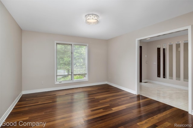 5893 Christina Dr, West Bloomfield, MI 48324 - unfurnished room featuring baseboards and wood finished floors