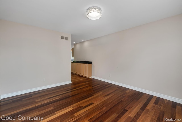 5893 Christina Dr, West Bloomfield, MI 48324 - unfurnished room with dark wood finished floors, baseboards, and recessed lighting