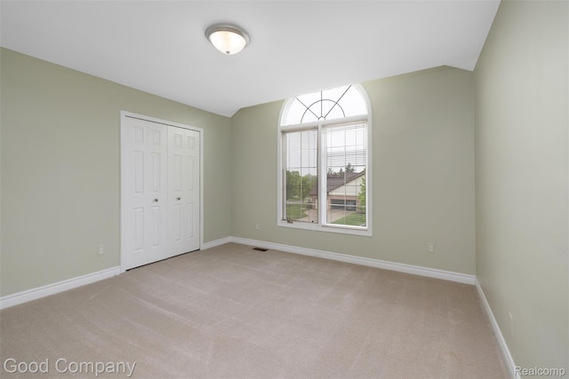 5893 Christina Dr, West Bloomfield, MI 48324 - unfurnished bedroom featuring carpet flooring, baseboards, and a closet
