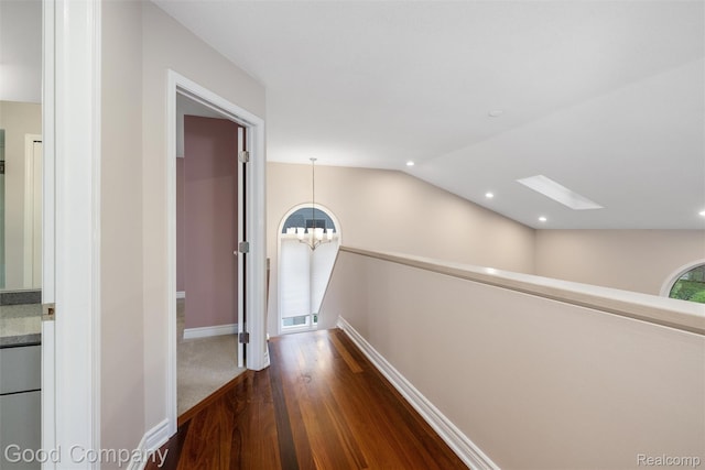 5893 Christina Dr, West Bloomfield, MI 48324 - hall with an upstairs landing, a chandelier, dark wood-type flooring, vaulted ceiling, and recessed lighting
