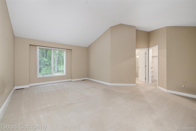 5893 Christina Dr, West Bloomfield, MI 48324 - spare room with vaulted ceiling, light colored carpet, and baseboards