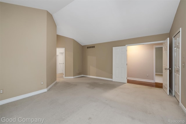 5893 Christina Dr, West Bloomfield, MI 48324 - unfurnished bedroom with vaulted ceiling, a closet, light colored carpet, and baseboards