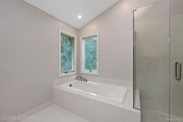 5893 Christina Dr, West Bloomfield, MI 48324 - bathroom with a garden tub, tiled shower, vaulted ceiling, and tile patterned flooring
