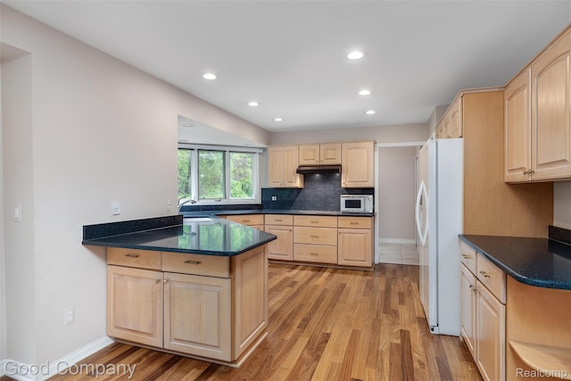 5893 Christina Dr, West Bloomfield, MI 48324 - kitchen with light brown cabinets, white appliances, light wood-style flooring, a peninsula, and under cabinet range hood