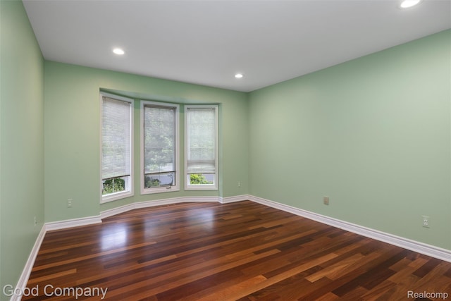 5893 Christina Dr, West Bloomfield, MI 48324 - empty room with dark wood-style flooring, baseboards, and recessed lighting